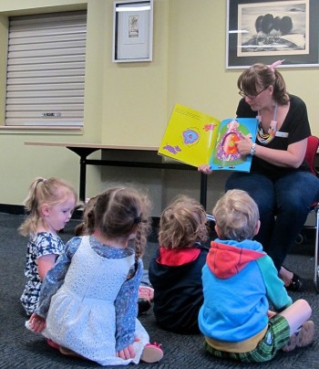 children listening to a story being sung